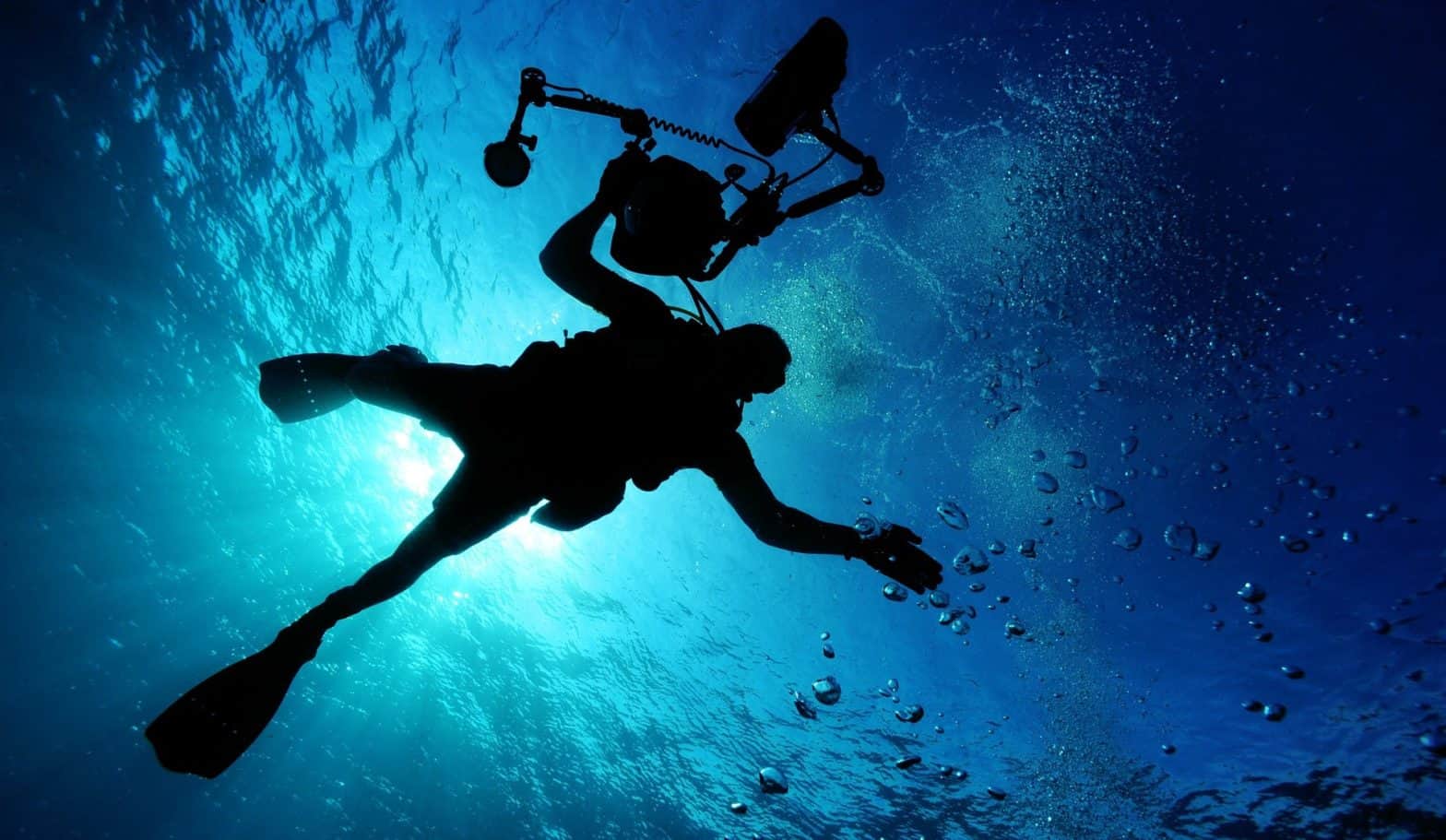 photo is a diver in the sea with what looks like camera equipment. Hopefully they know the dangers of nitrogen narcosis.