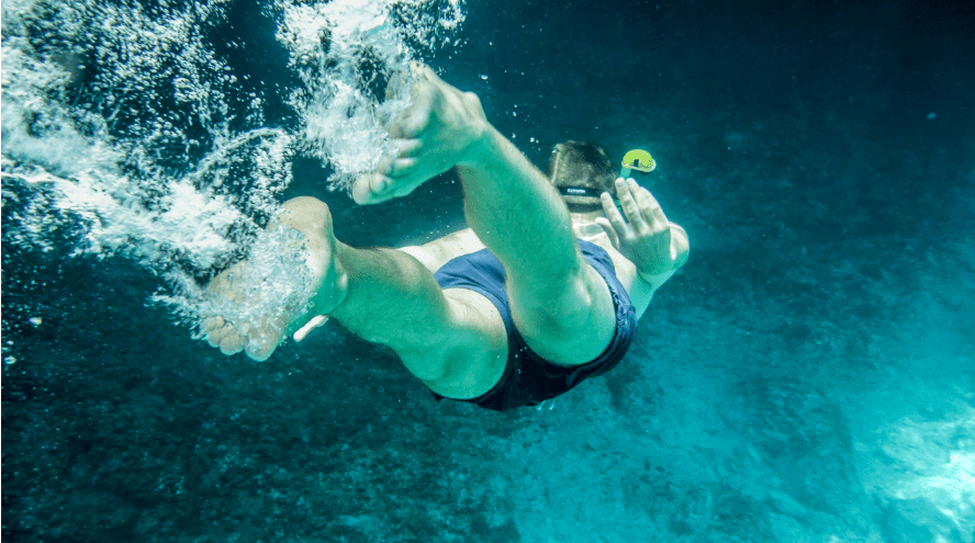 person in underwater green lake austria